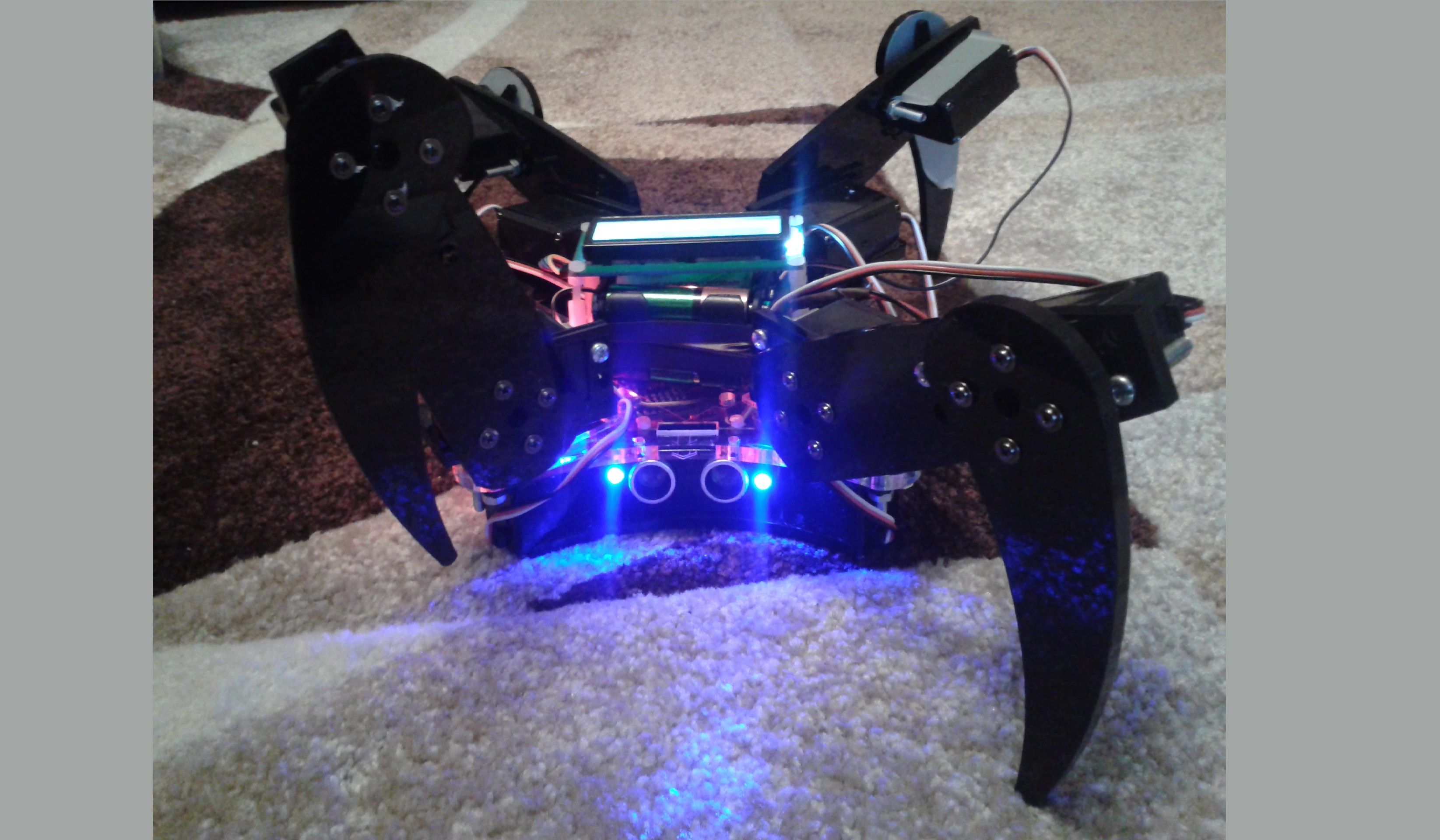 Robot on the floor with lights and LCD turned on